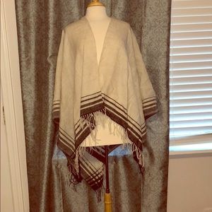 Light grey poncho/cape with black details